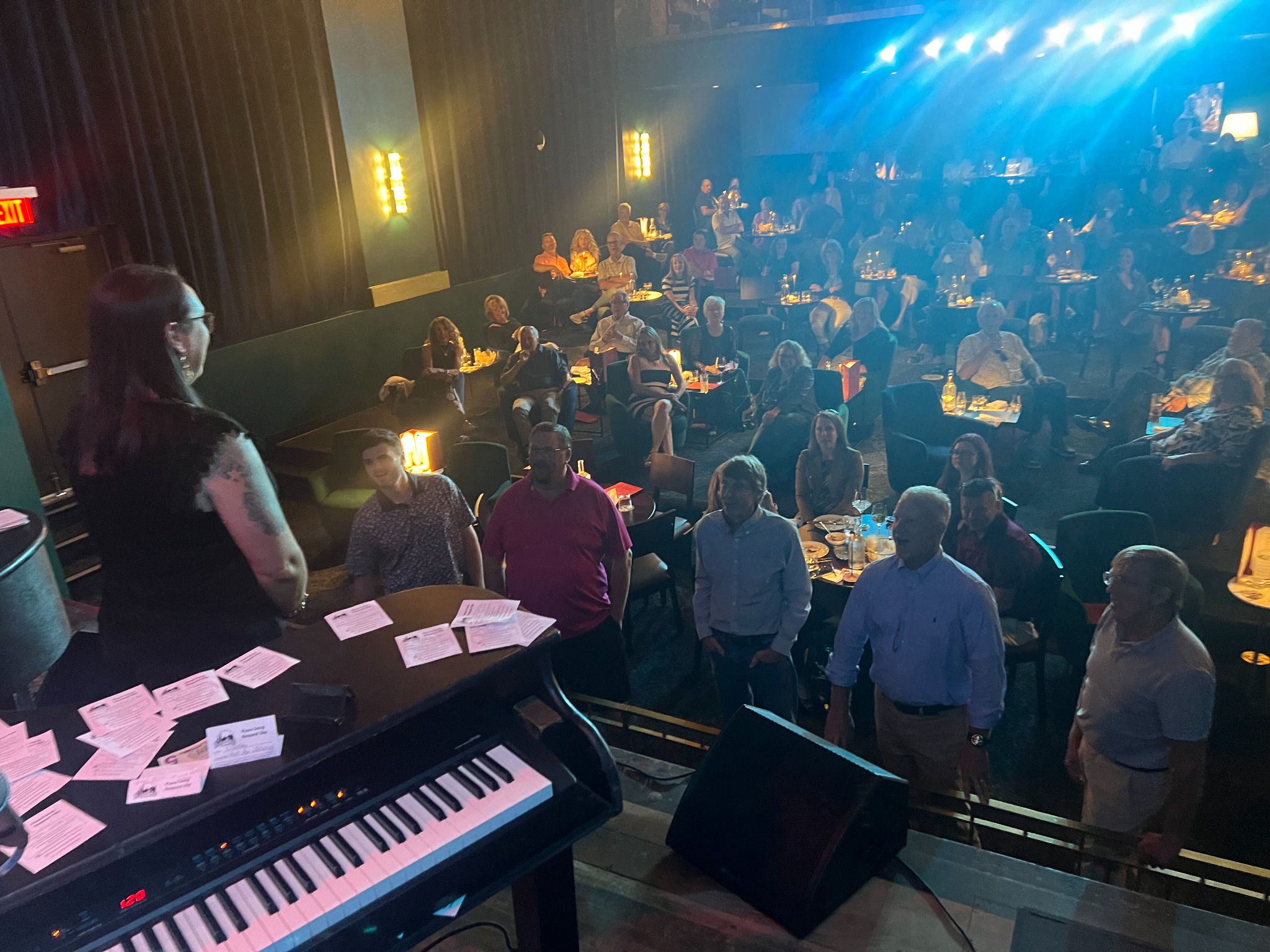 Audience enjoying an interactive dueling piano show