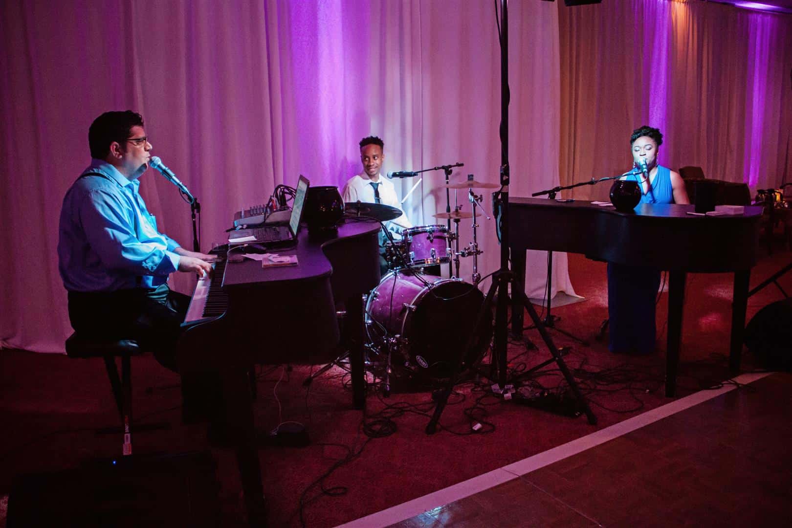 Dueling piano show with drums and full-band production
