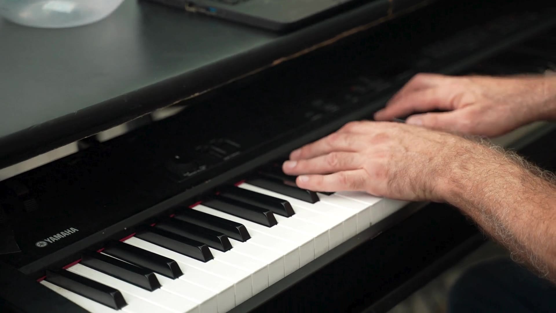 Close-up of piano performance at a live dueling piano event