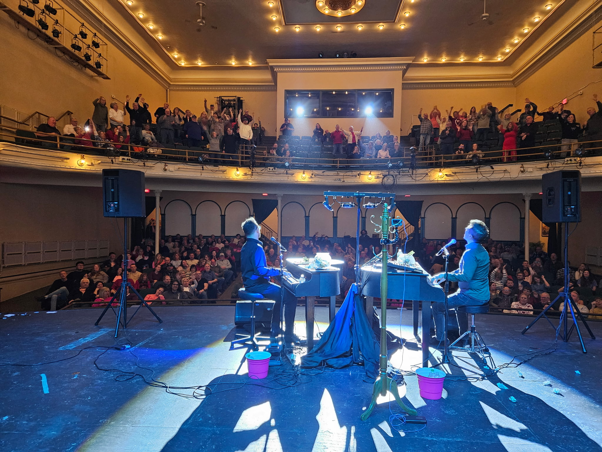 Audience watching a Midwest Dueling Pianos theater performance