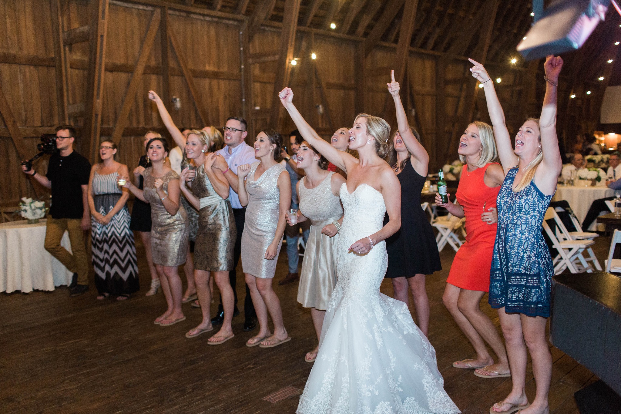 Bride and guests celebrating during a Midwest Dueling Pianos wedding performance